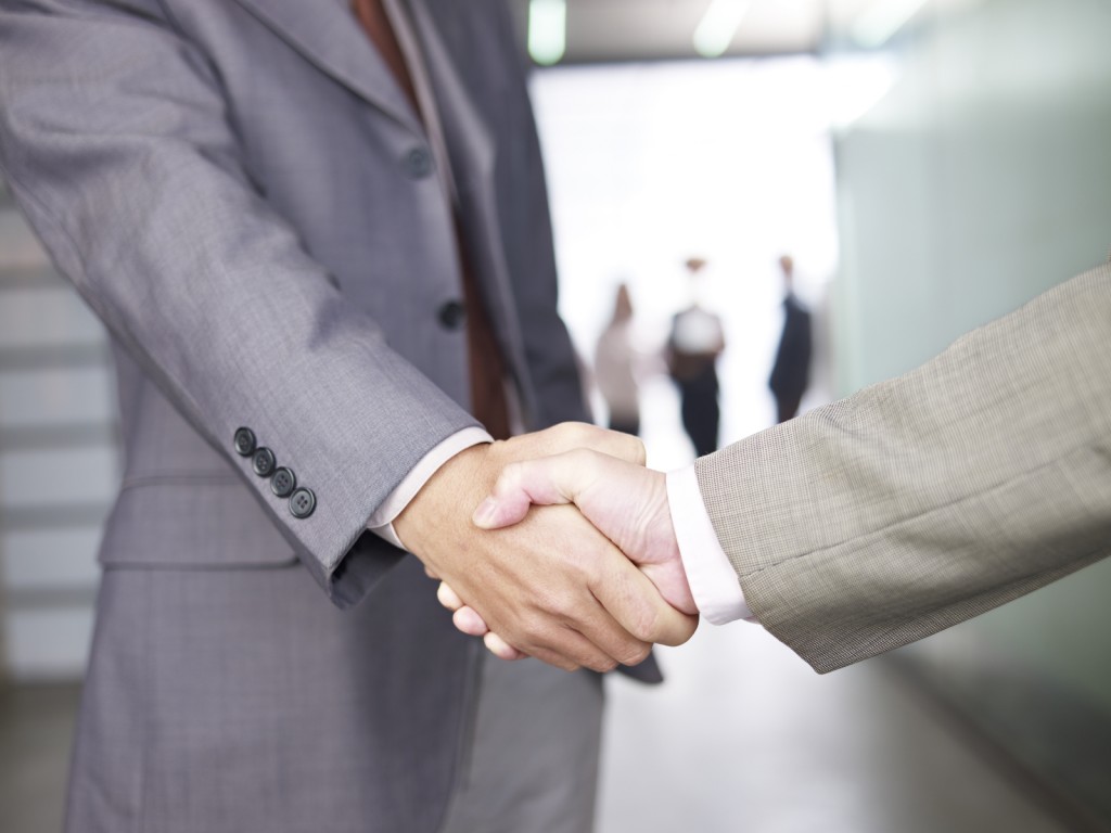 businesspeople shaking hands.