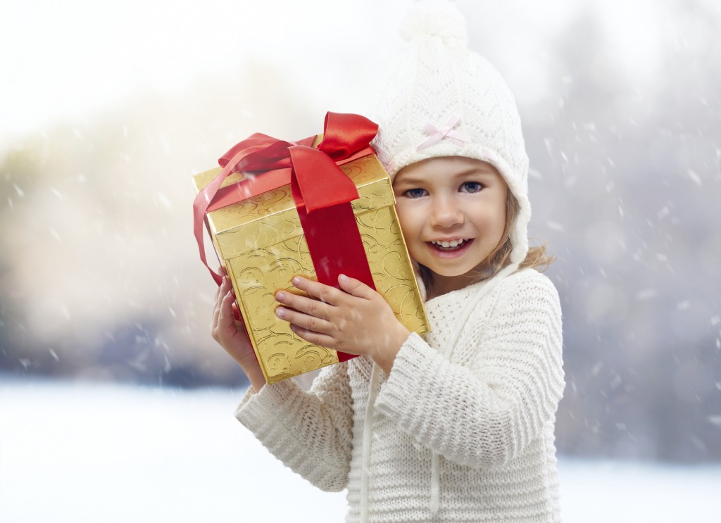 child with christmas gift