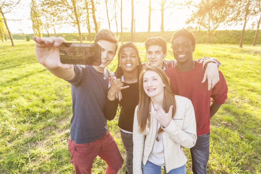 Teenage Friends Taking Selfie at Park