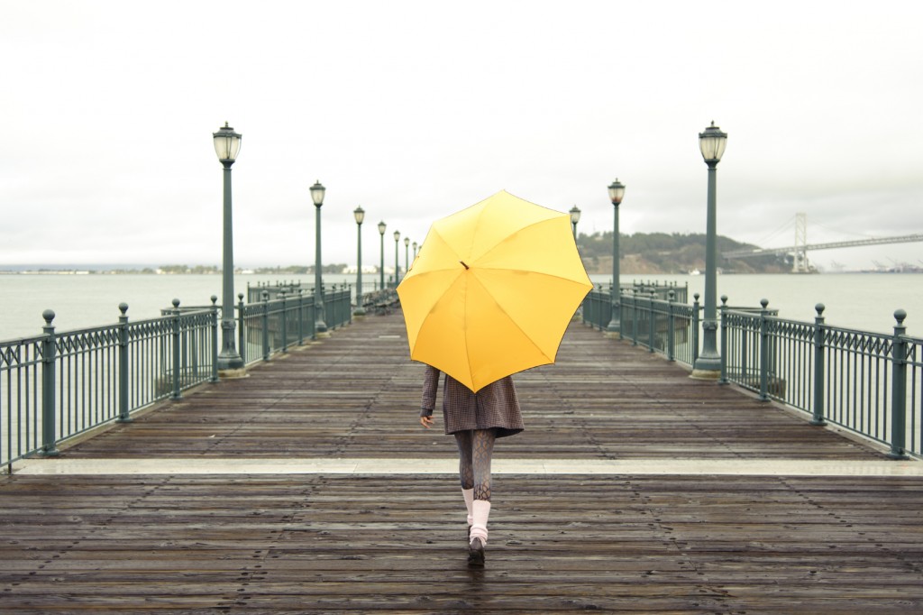 girl walking with umbrella
