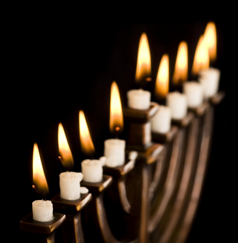Beautiful lit hanukkah menorah on black. Super black background