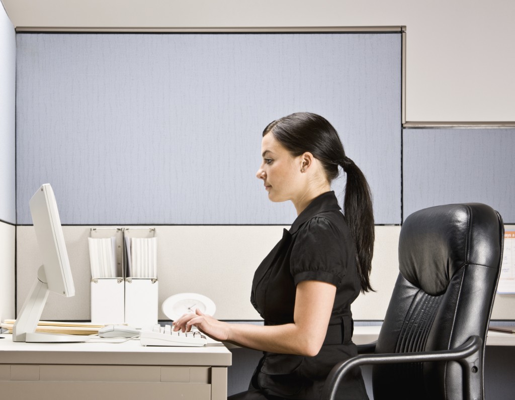 woman sitting at desk with good posture