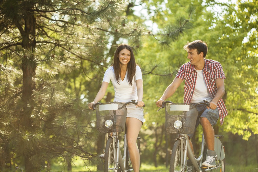 Young couple riding bicycles