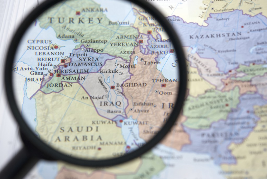 Syria and the Middle East on a map seen through a magnifying glass