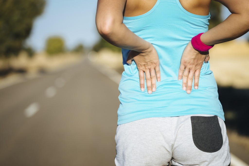Female runner back pain