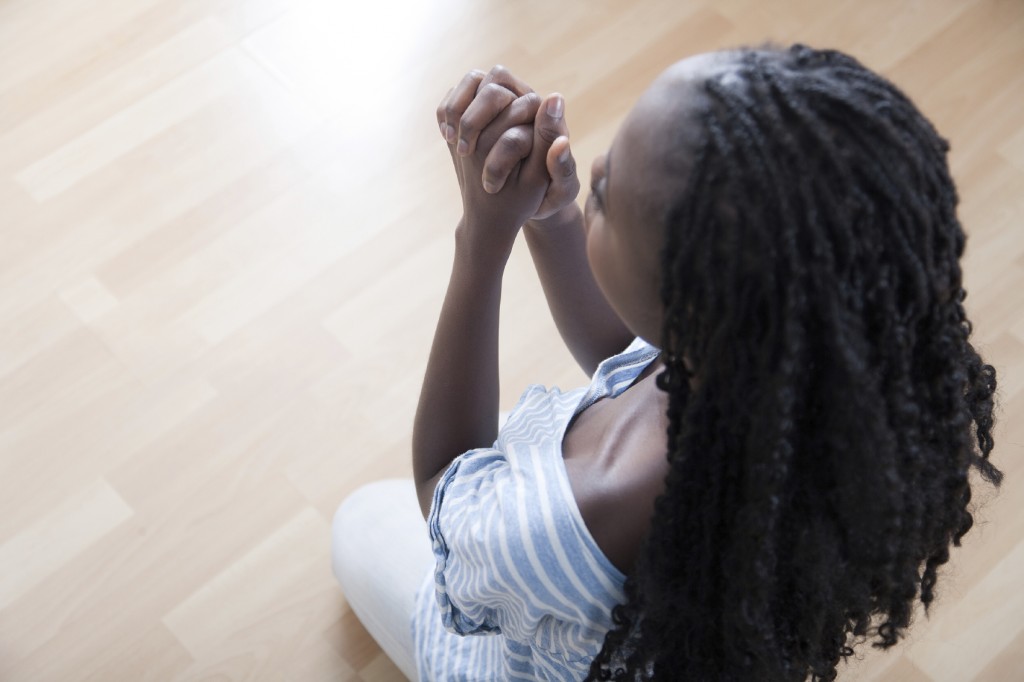 Young African Woman Praying