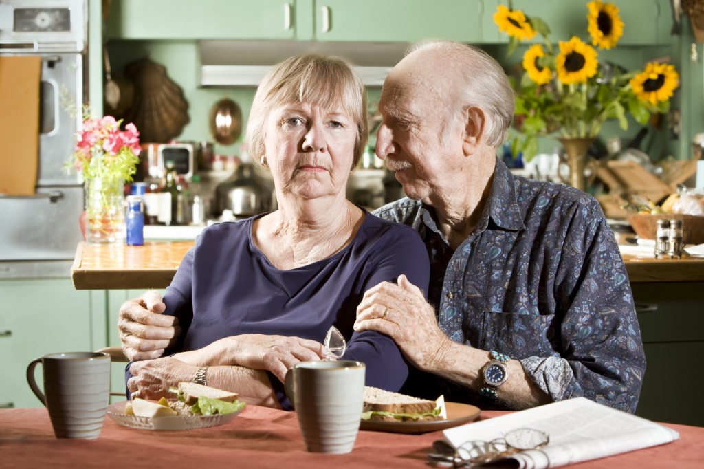 Senior Sad Senior Couple in their Dining Room