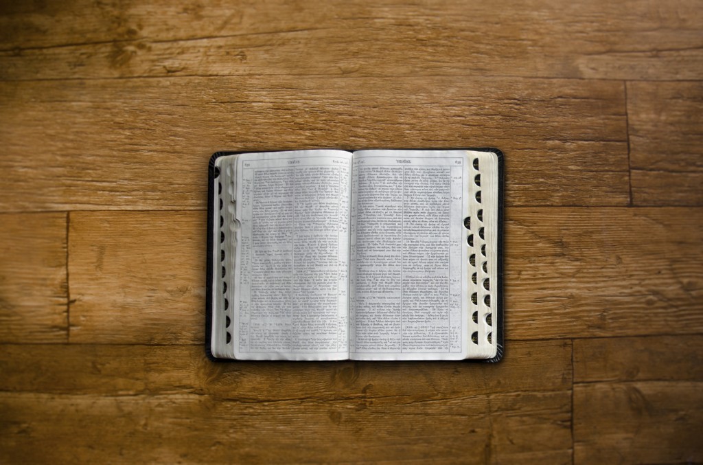 Bible open on a wooden table