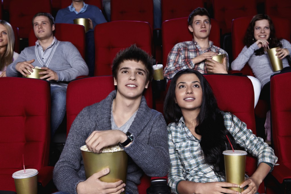 Young people watching movies in the cinema