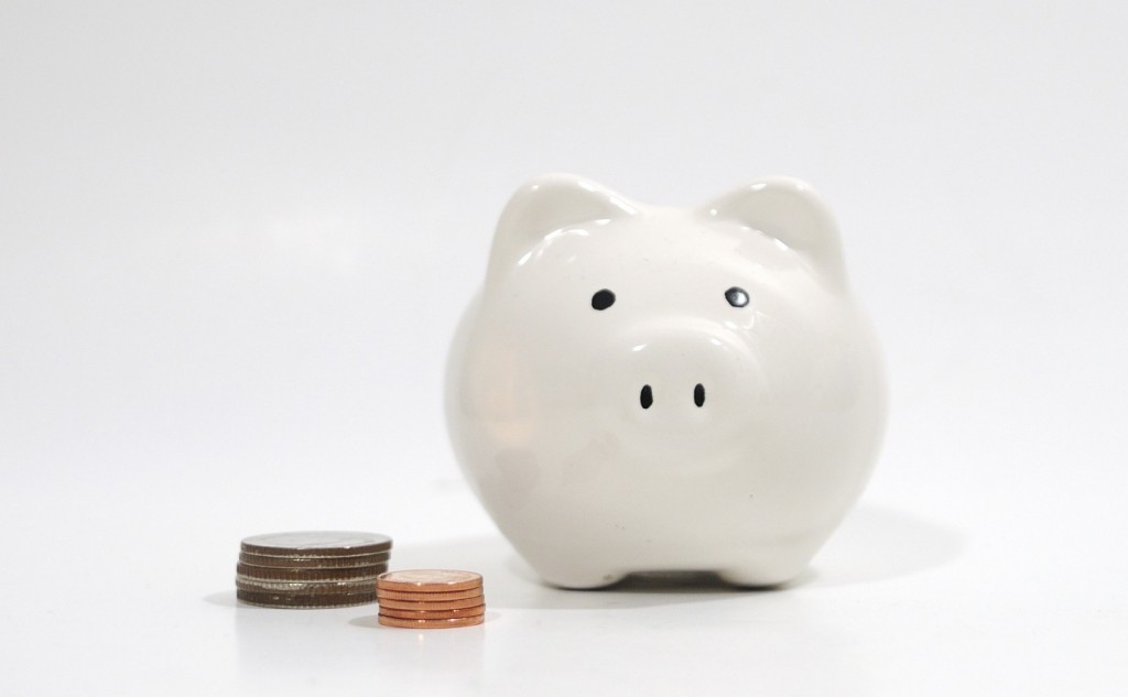 White piggy bank with coins.