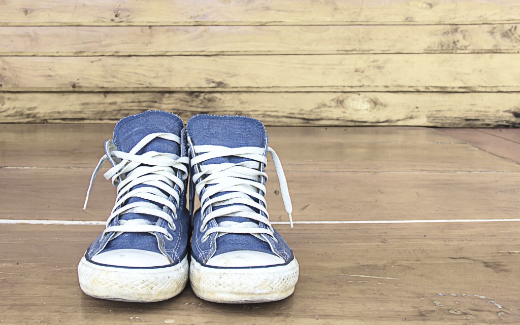 blue sneakers on the wooden floor, vintage