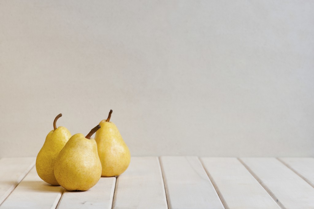 Yellow pears on the white table