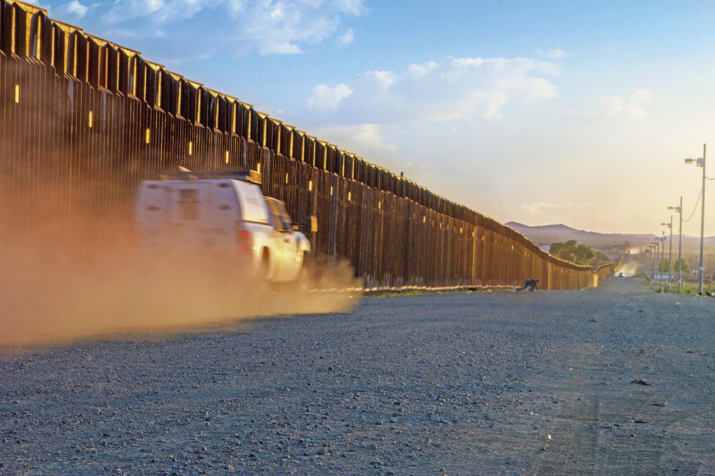 Border patrol trucks driving to catch illegal alien