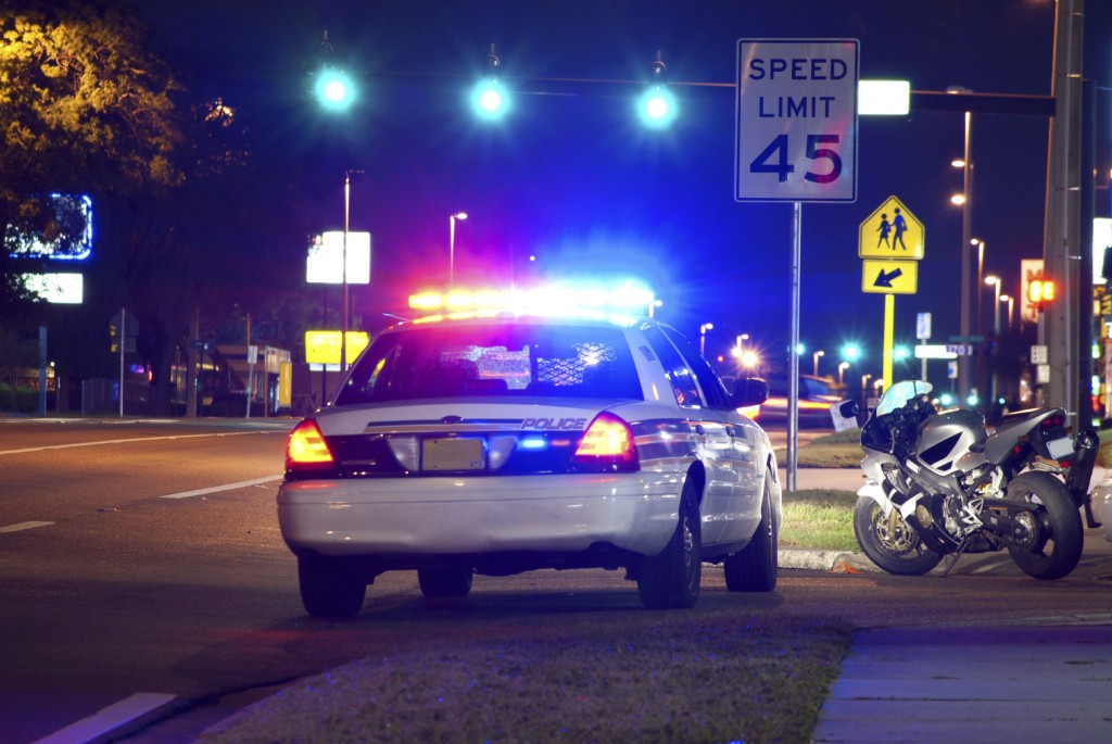 Motorcycle pulled over at night