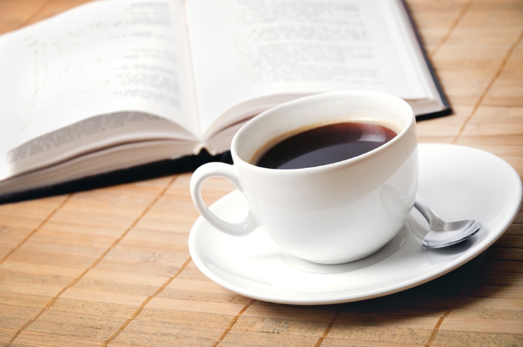 Cup of coffee with book