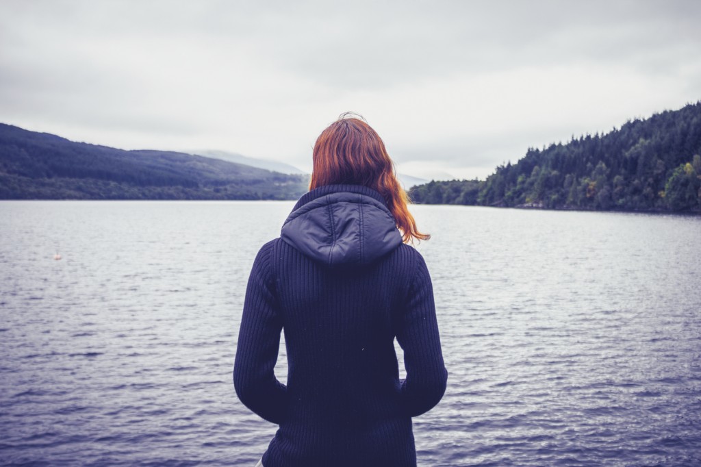 Woman admiring stillness of the lake