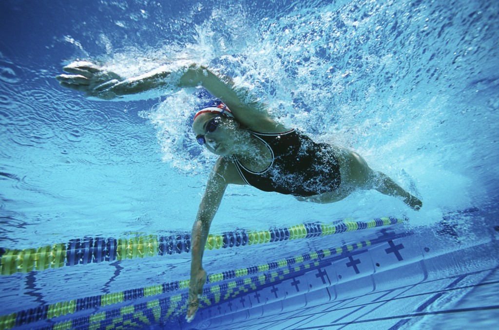 Female Swimmer Swimming In Pool