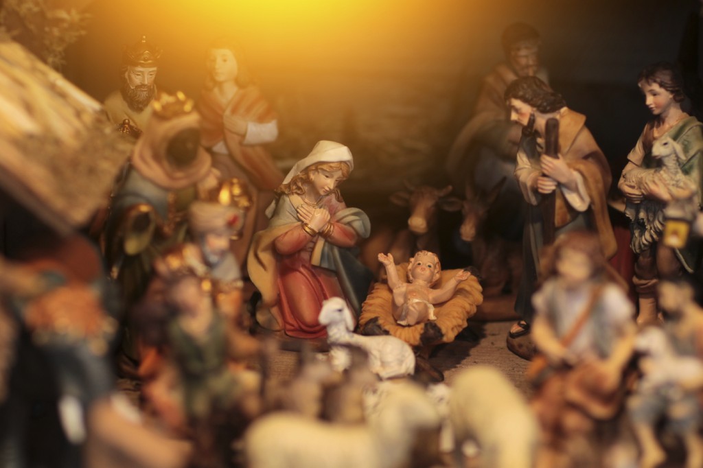 Christmas scene with figurines including Jesus, Mary, Joseph, king