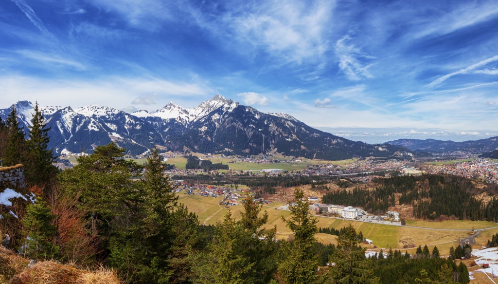 anoramic view of Reutte with Alps and clouds