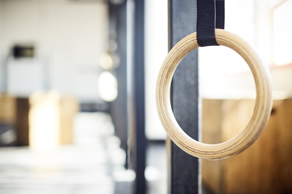 Close-up of gymnastic ring hanging in gym