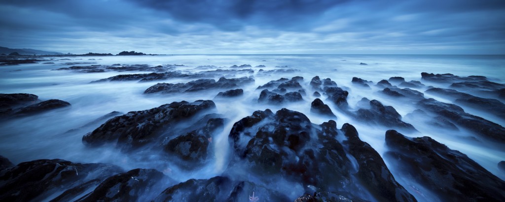 A super wide angle shot of rocks along the rugged west coast of New Zealand, near Punakaiki.
