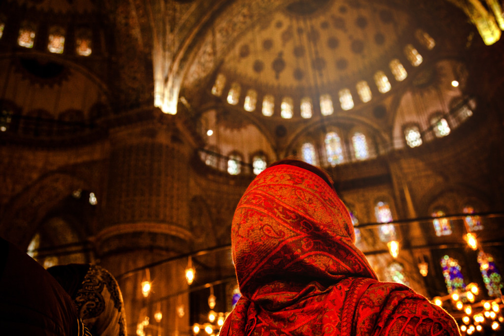 Woman praying inside a mosque in Istanbul, Turkey.