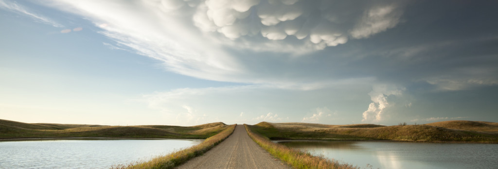Mammatus storm clouds over a prarie dirt road, Saskatchewan, Canada