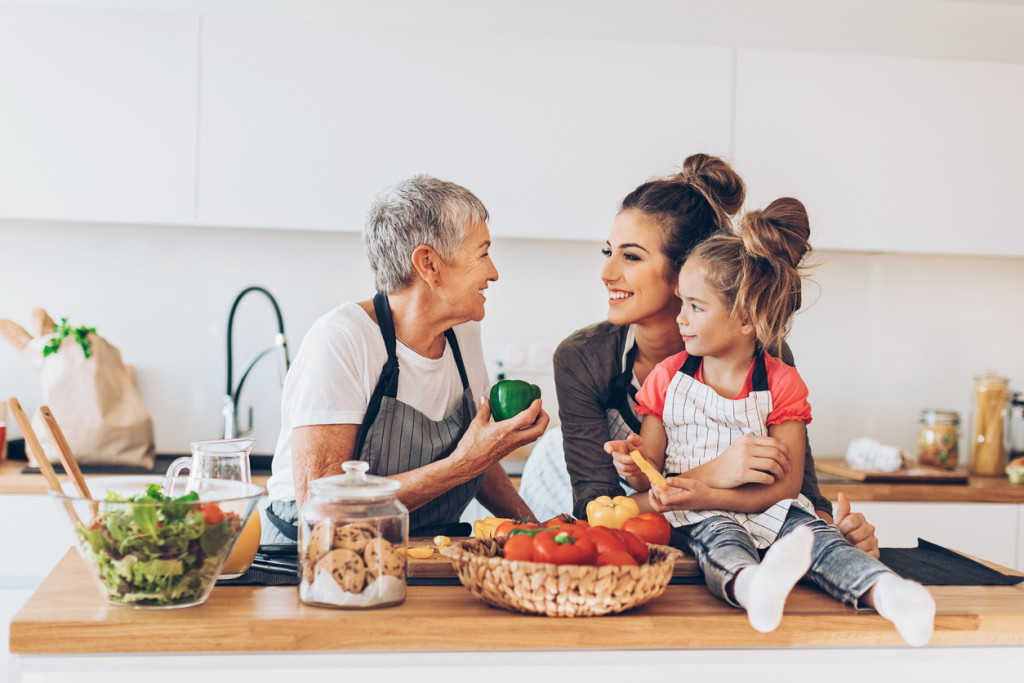 Three-generations women in the kitchen
