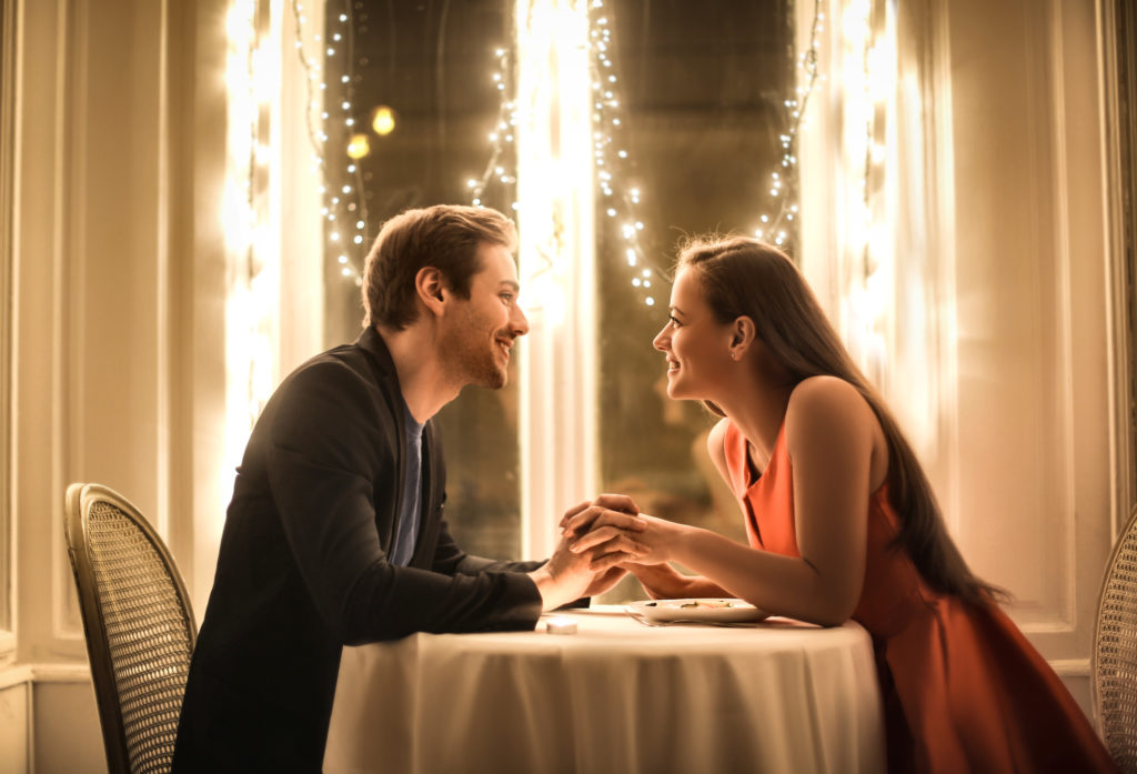 Sweet couple having a romantic dinner in an elegant restaurant
