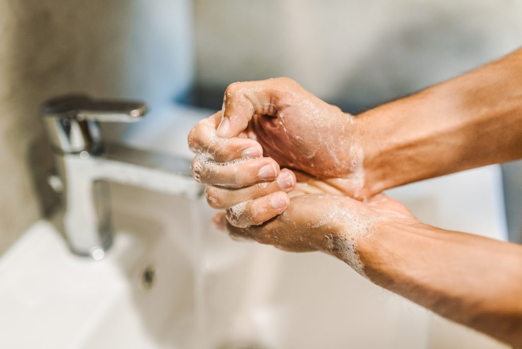 Man washing his hands.
