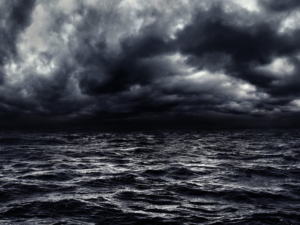dark stormy sea with a dramatic cloudy hate-ful looking sky