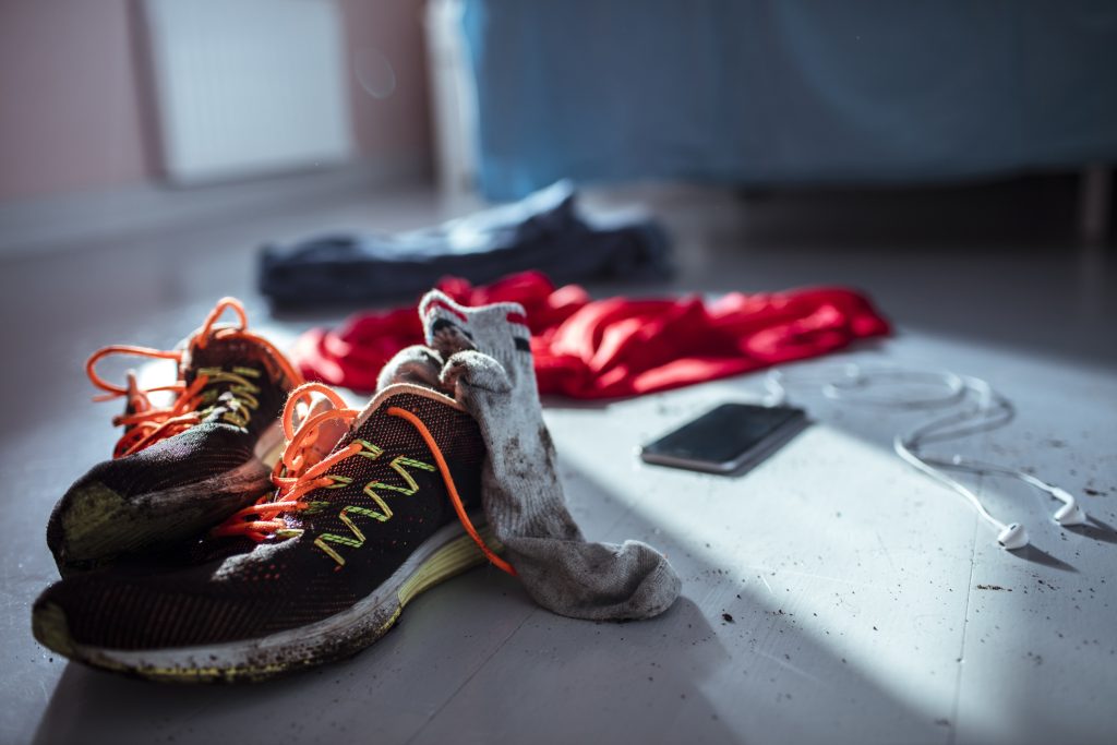 Close up of shoes and clothing of an athlete after a workout, nagging